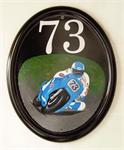 House Number Sign showing Motor Bike Rider